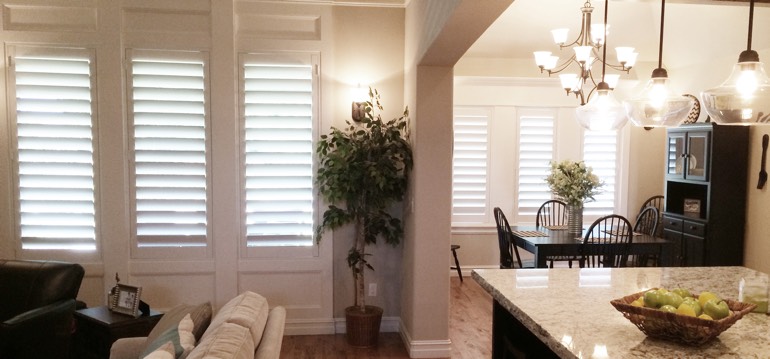Cleveland shutters in dining room and living room